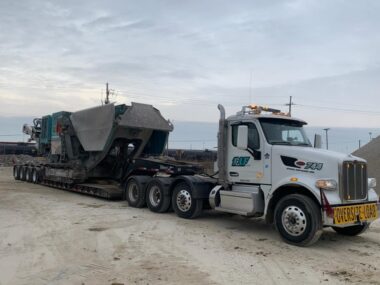 KLF hauling a crusher to a new demo job