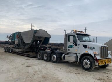 KLF hauling a crusher to a new demo job